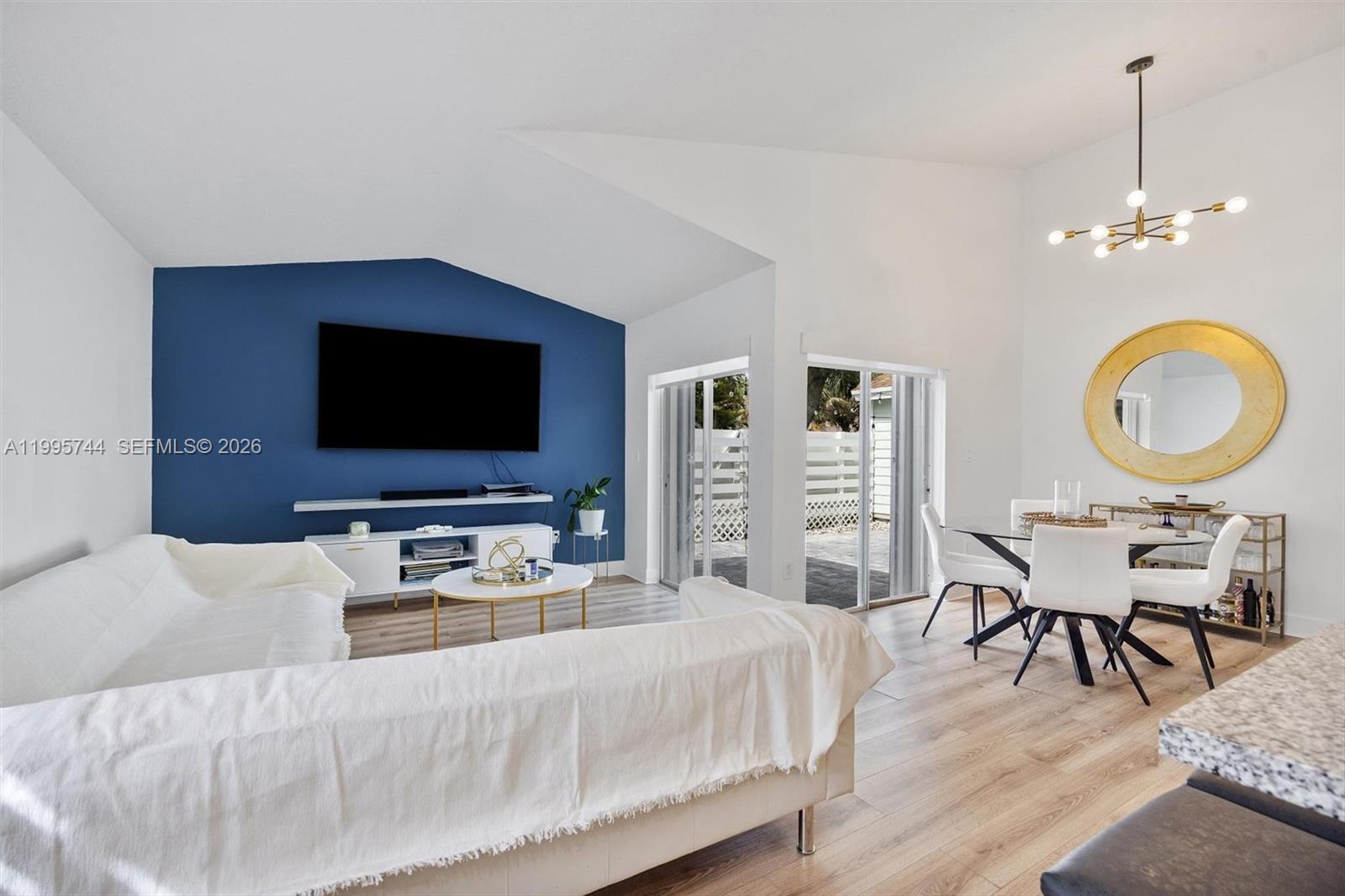 14720 Southwest 139th Avenue, Unit 139 Miami, FL 33186 - Photo 1 of 34 a bedroom with a bed and a flat screen tv