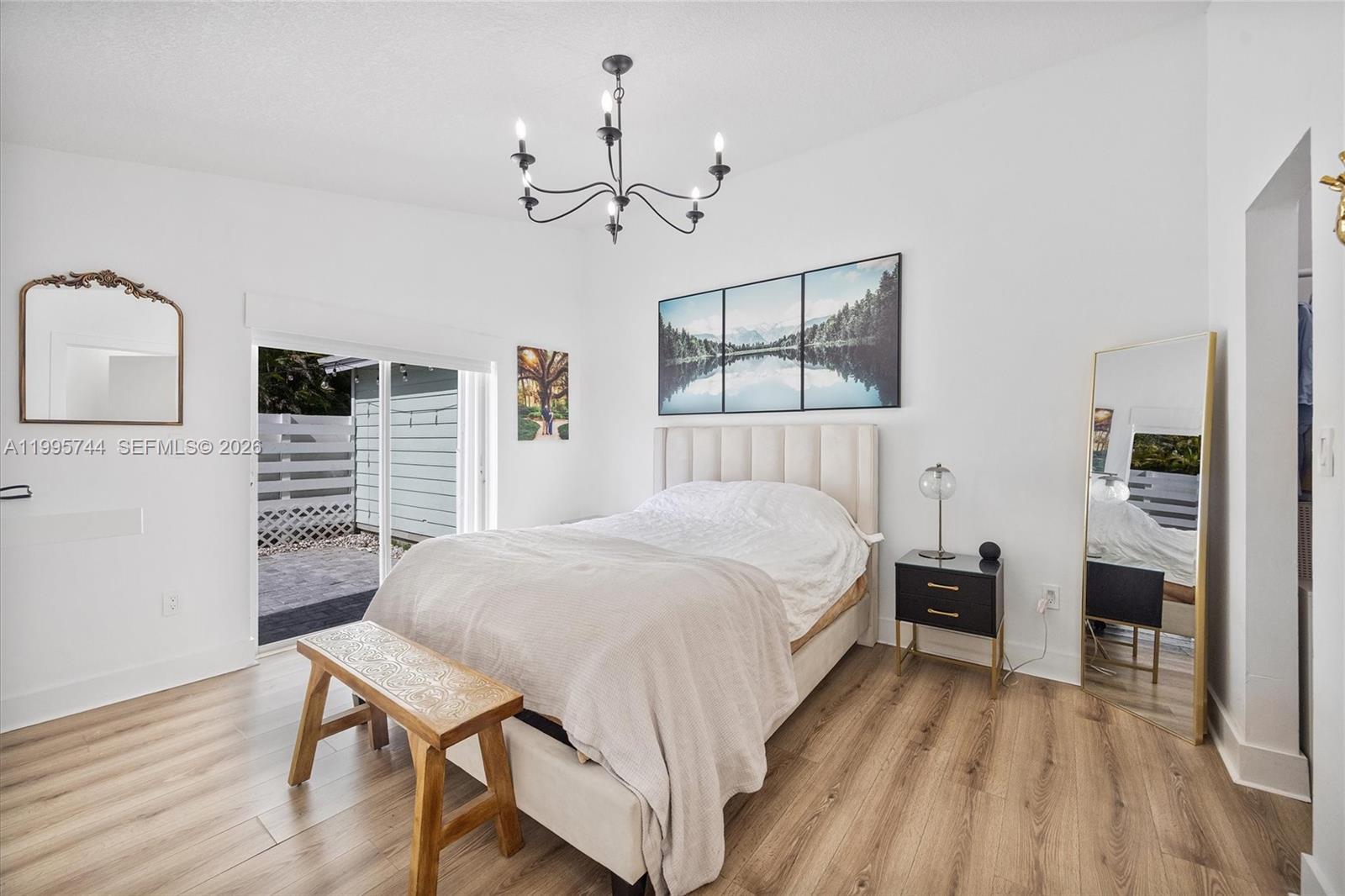 14720 Southwest 139th Avenue, Unit 139 Miami, FL 33186 - Photo 14 of 34 a bed room with a bed and a table