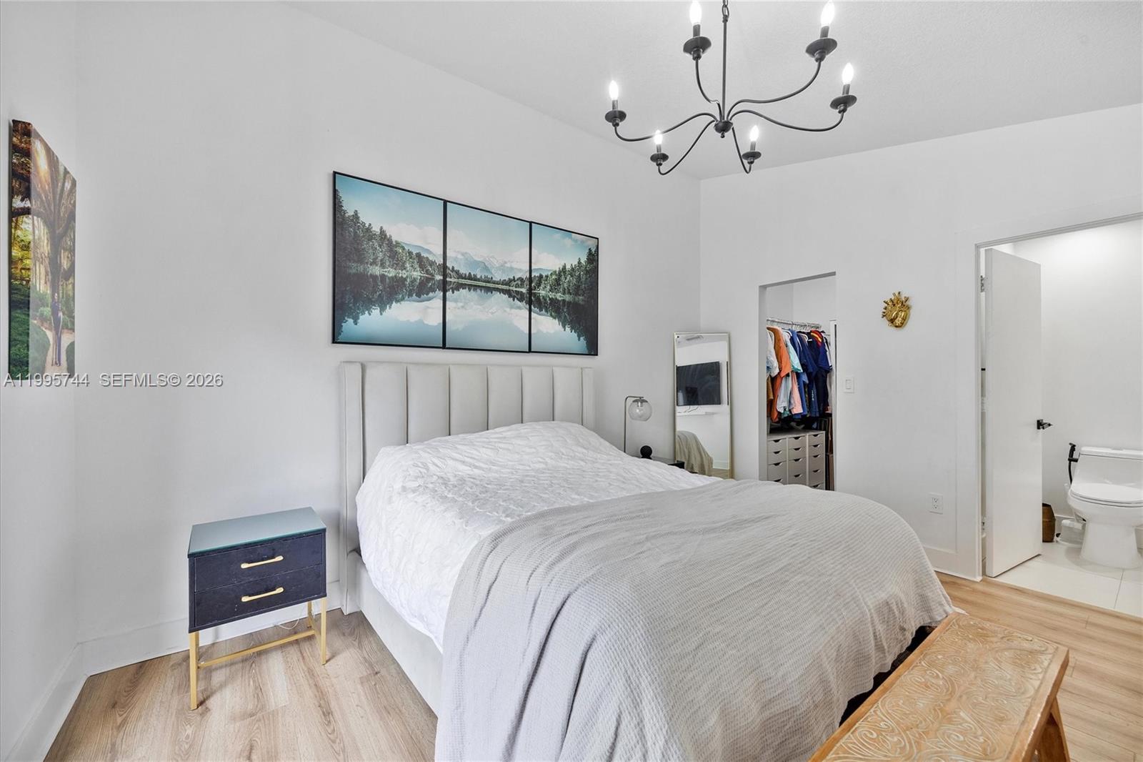 14720 Southwest 139th Avenue, Unit 139 Miami, FL 33186 - Photo 20 of 34 a bedroom with a bed and a table