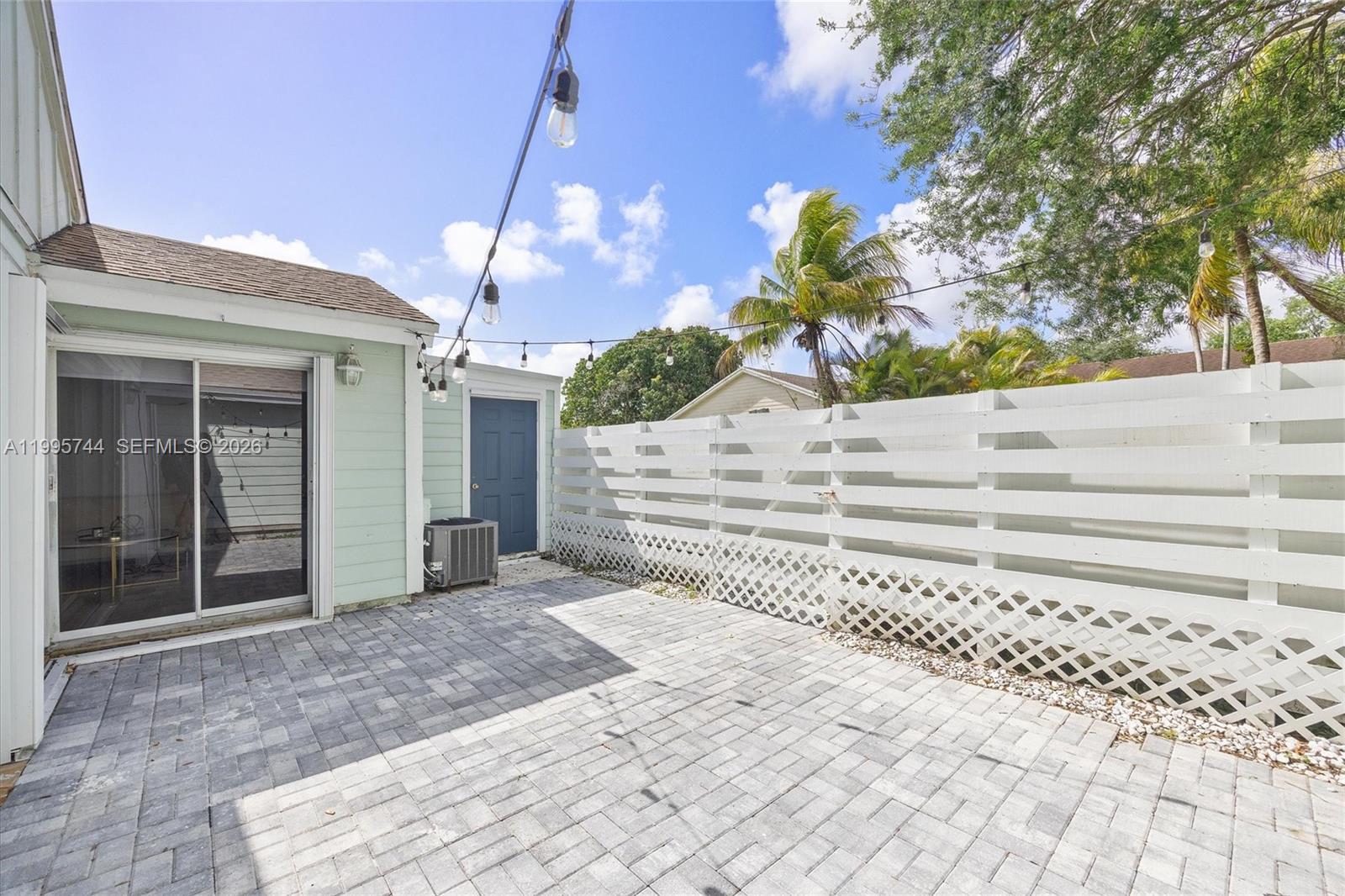 14720 Southwest 139th Avenue, Unit 139 Miami, FL 33186 - Photo 22 of 34 a view of a house with a yard and potted plants