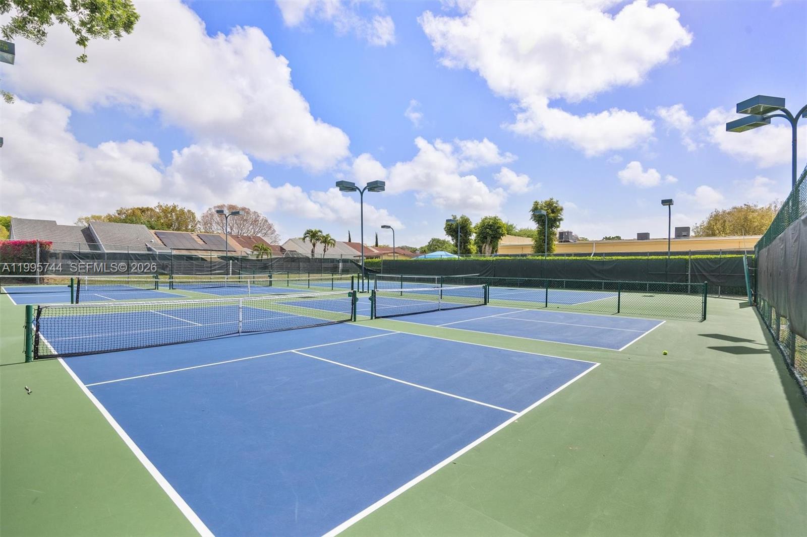 14720 Southwest 139th Avenue, Unit 139 Miami, FL 33186 - Photo 33 of 34 a view of a tennis court