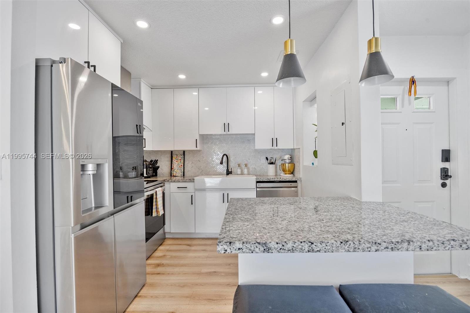 14720 Southwest 139th Avenue, Unit 139 Miami, FL 33186 - Photo 4 of 34 a large kitchen with cabinets