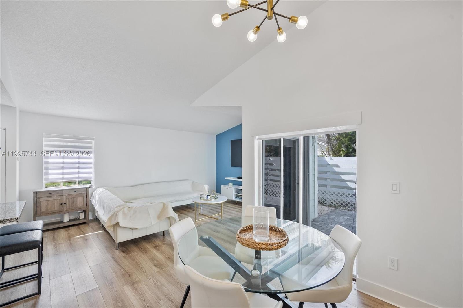 14720 Southwest 139th Avenue, Unit 139 Miami, FL 33186 - Photo 9 of 34 a living room with furniture and a wooden floor