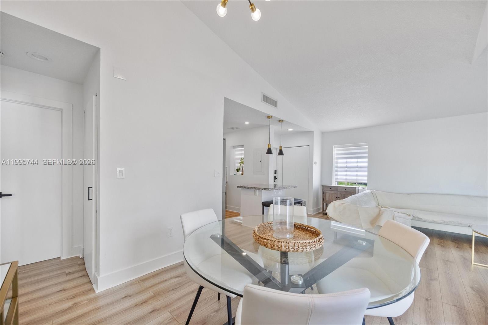 14720 Southwest 139th Avenue, Unit 139 Miami, FL 33186 - Photo 10 of 34 a dining room with furniture and wooden floor