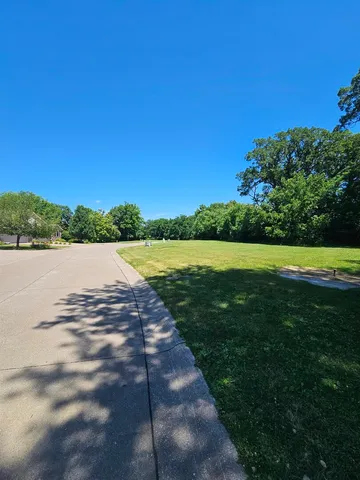 a view of a lake with houses in the back