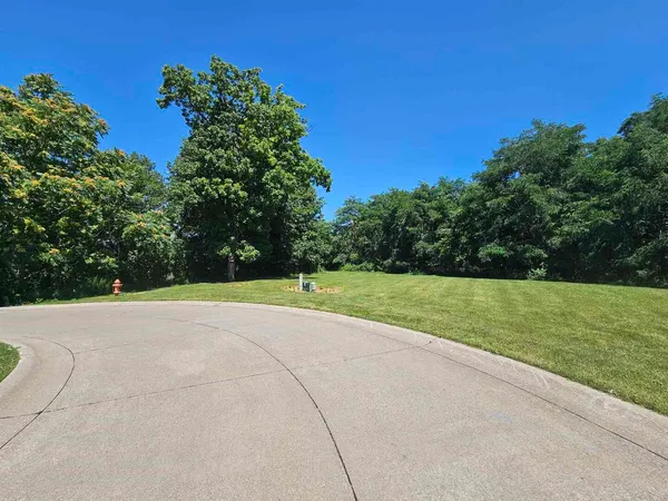 a view of a field with an outdoor space