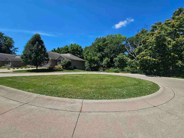 a view of a lake with a yard