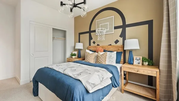a bedroom with a bed and a dresser