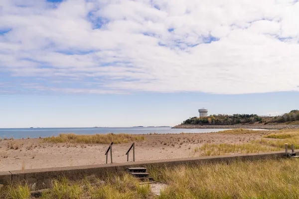 a bathroom with a double vanity sink a mirror and a shower