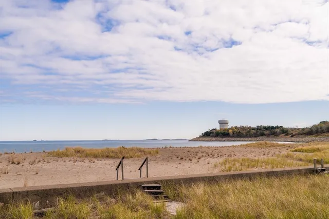 a bathroom with a double vanity sink a mirror and a shower