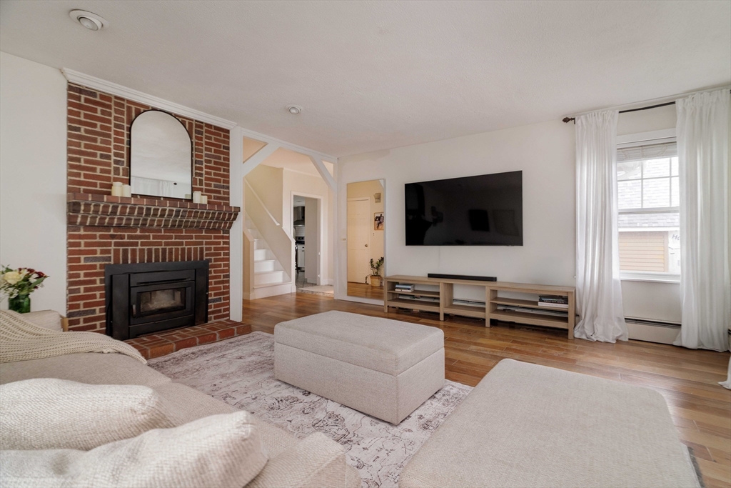 129 The Strand Winthrop, MA 02152 - Photo 16 of 42 a living room with furniture and a flat screen tv