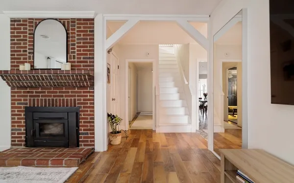 a bedroom with a bed and flat tv screen on the dresser