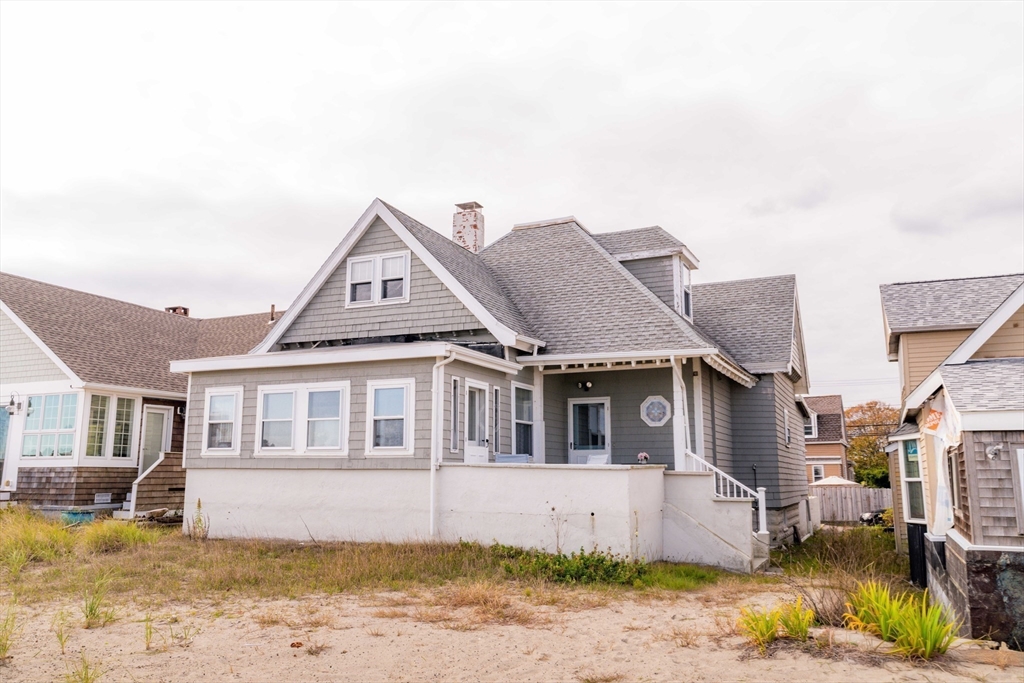 129 The Strand Winthrop, MA 02152 - Photo 2 of 42 a view of a house with a yard