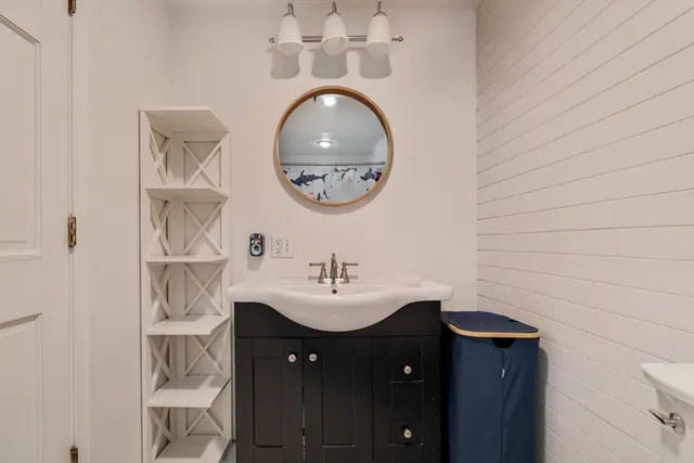 a spacious bedroom with a bed and a flat screen television