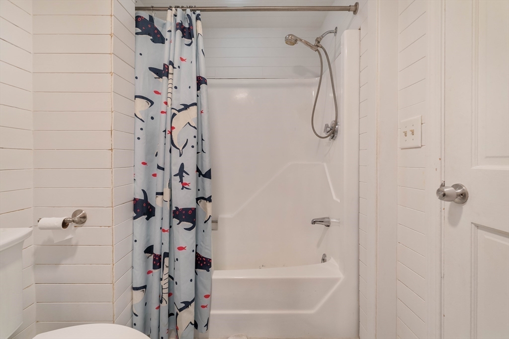129 The Strand Winthrop, MA 02152 - Photo 22 of 42 a bathroom with a shower and a shower