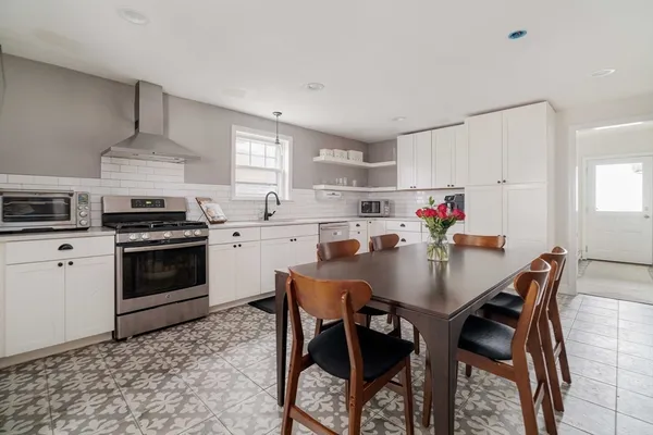 a living room with couches and a flat screen tv
