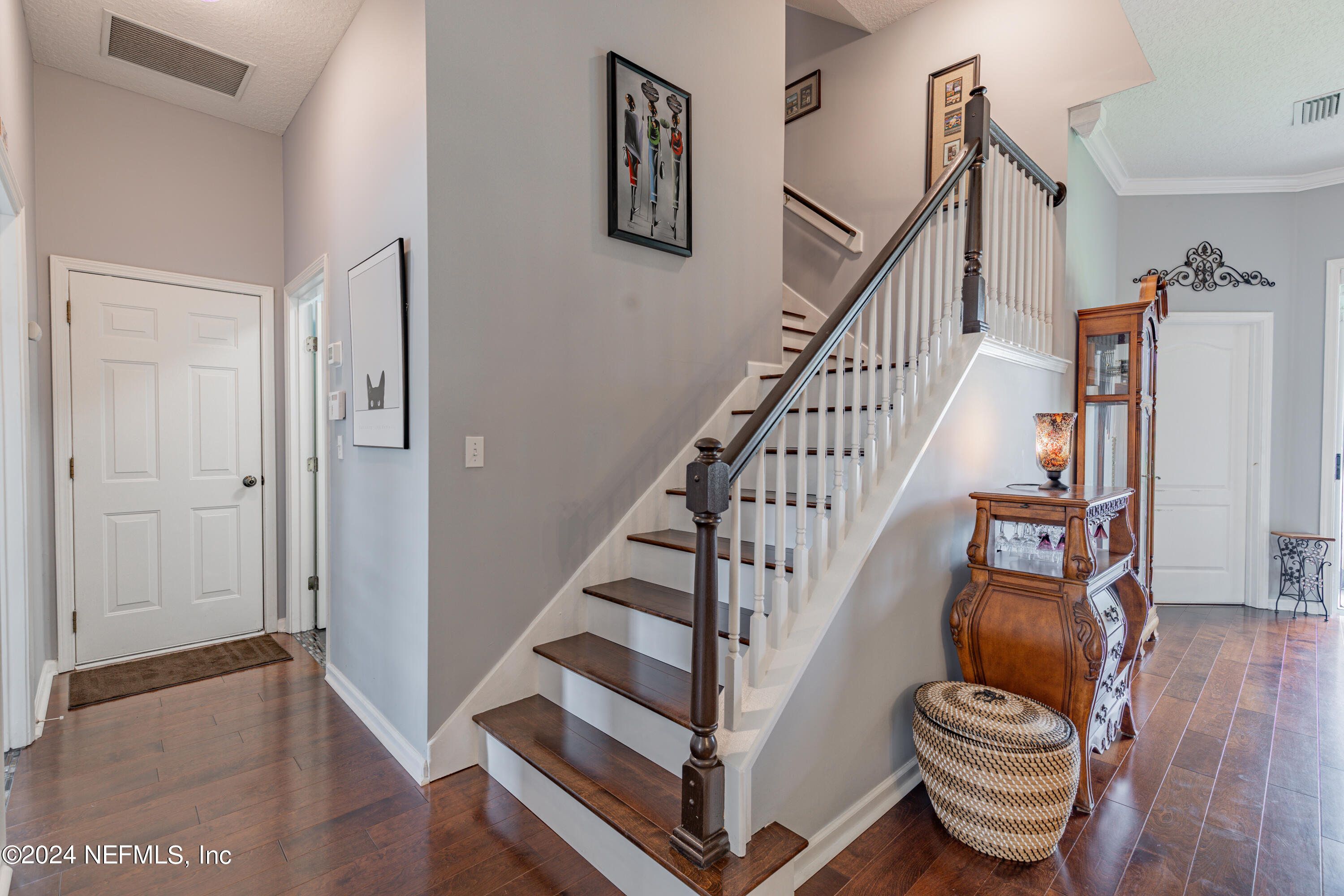 1830 Copper Stone Drive, Unit D Fleming Island, FL 32003 - Photo 21 of 65 a view of entryway and hall with wooden floor