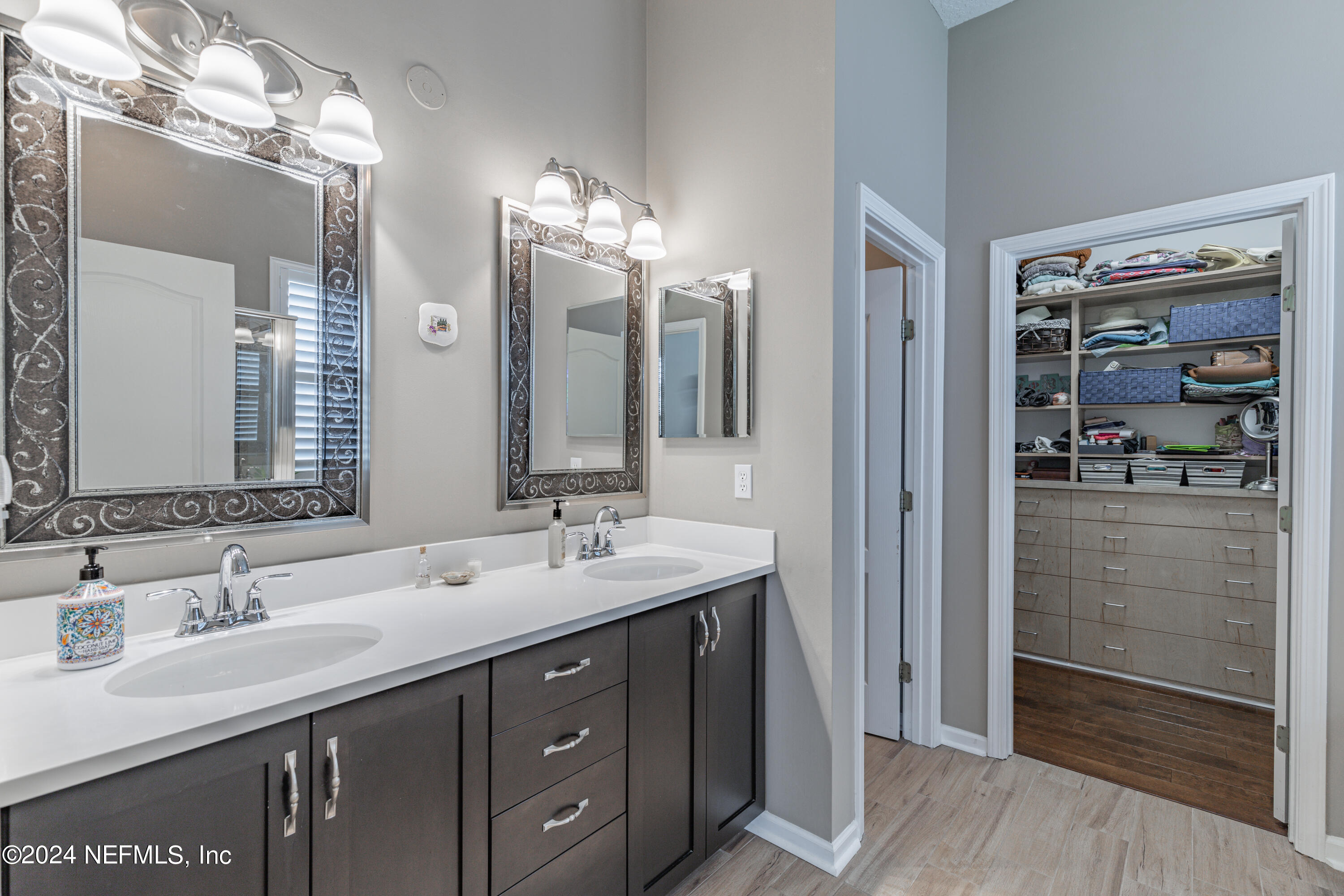 1830 Copper Stone Drive, Unit D Fleming Island, FL 32003 - Photo 36 of 65 a bathroom with double vanity sinks and a shower