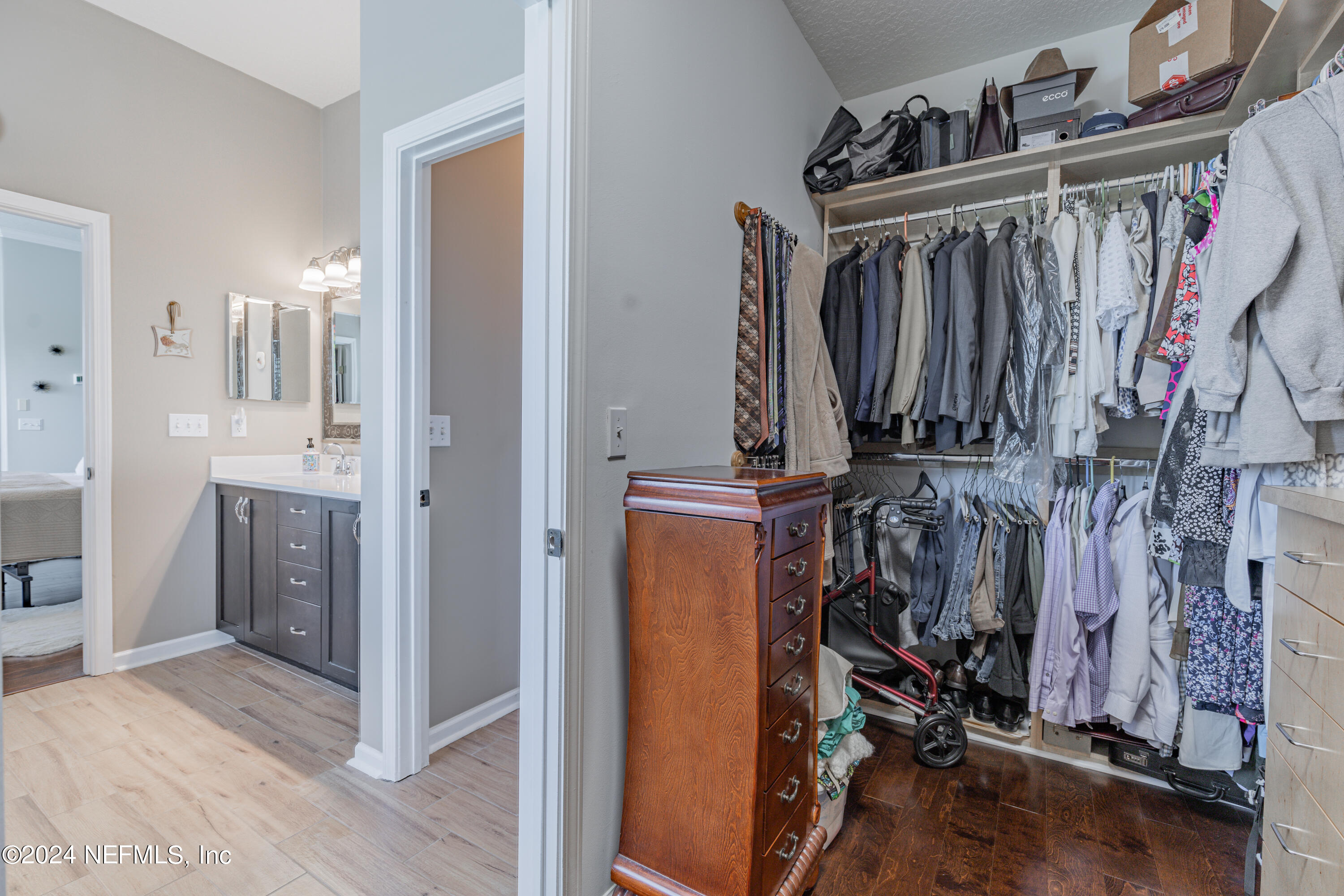 1830 Copper Stone Drive, Unit D Fleming Island, FL 32003 - Photo 38 of 65 a view of walk in closet with clothes and shoes