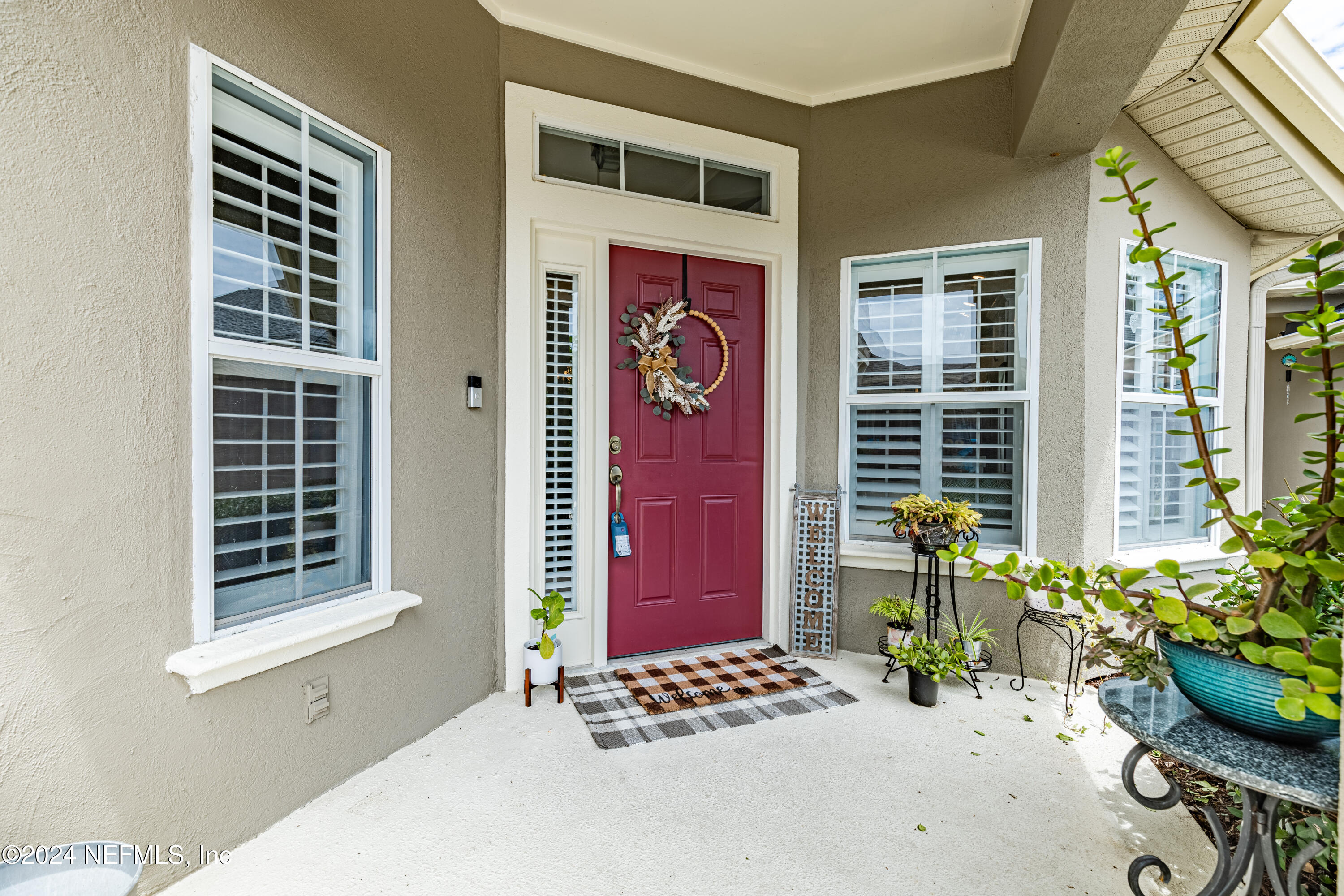 1830 Copper Stone Drive, Unit D Fleming Island, FL 32003 - Photo 4 of 65 a front view of a house with outdoor seating