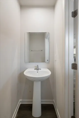 a bathroom with a sink a mirror and shower