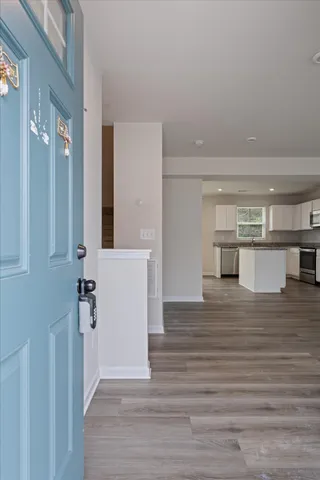 a view of a kitchen from the hallway