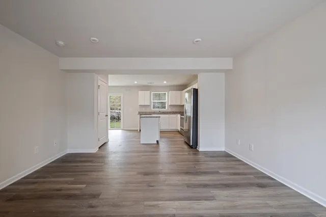 a view of kitchen with wooden floor
