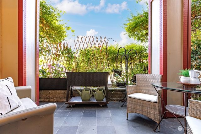 a outdoor living space with furniture and a potted plant