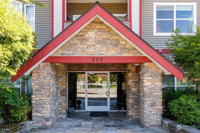 a view of a wooden house with a large window