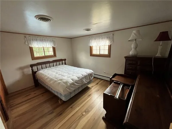 a spacious bathroom with a double vanity sink and a mirror