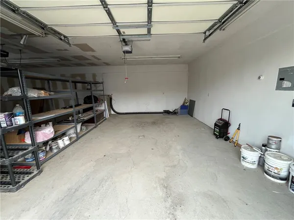 a kitchen with a sink and wooden floor