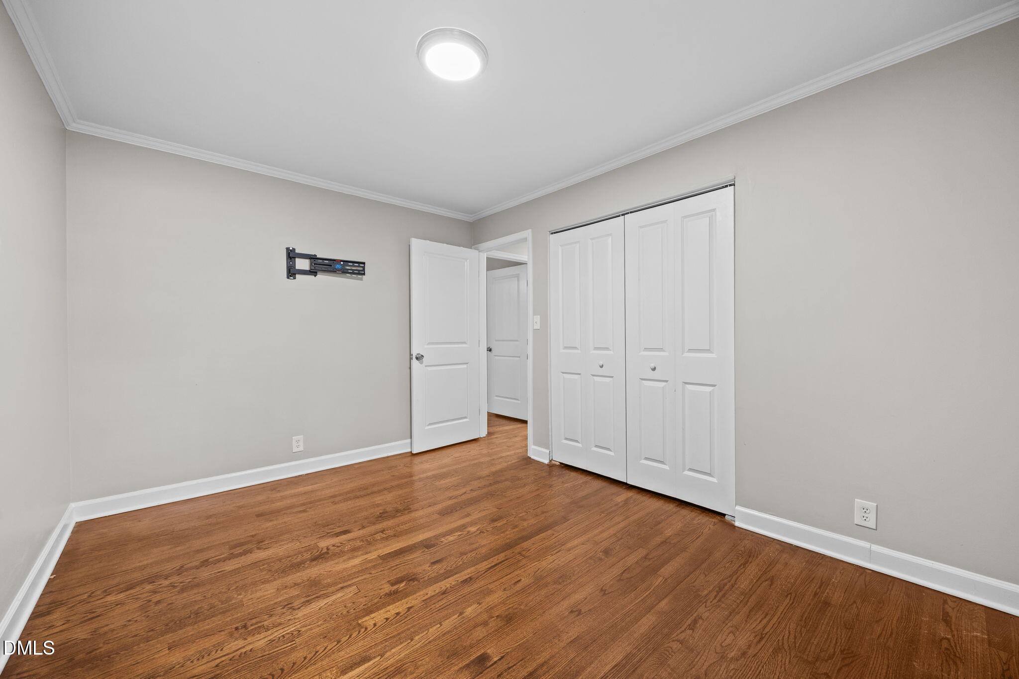 2950 Glenridge Drive Raleigh, NC 27604 - Photo 37 of 53 a view of an empty room with wooden floor