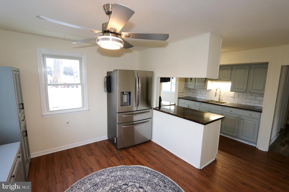 201 Castello Avenue Hatboro, PA 19040 - Photo 12 of 64 a kitchen with a refrigerator cabinets and wooden floor