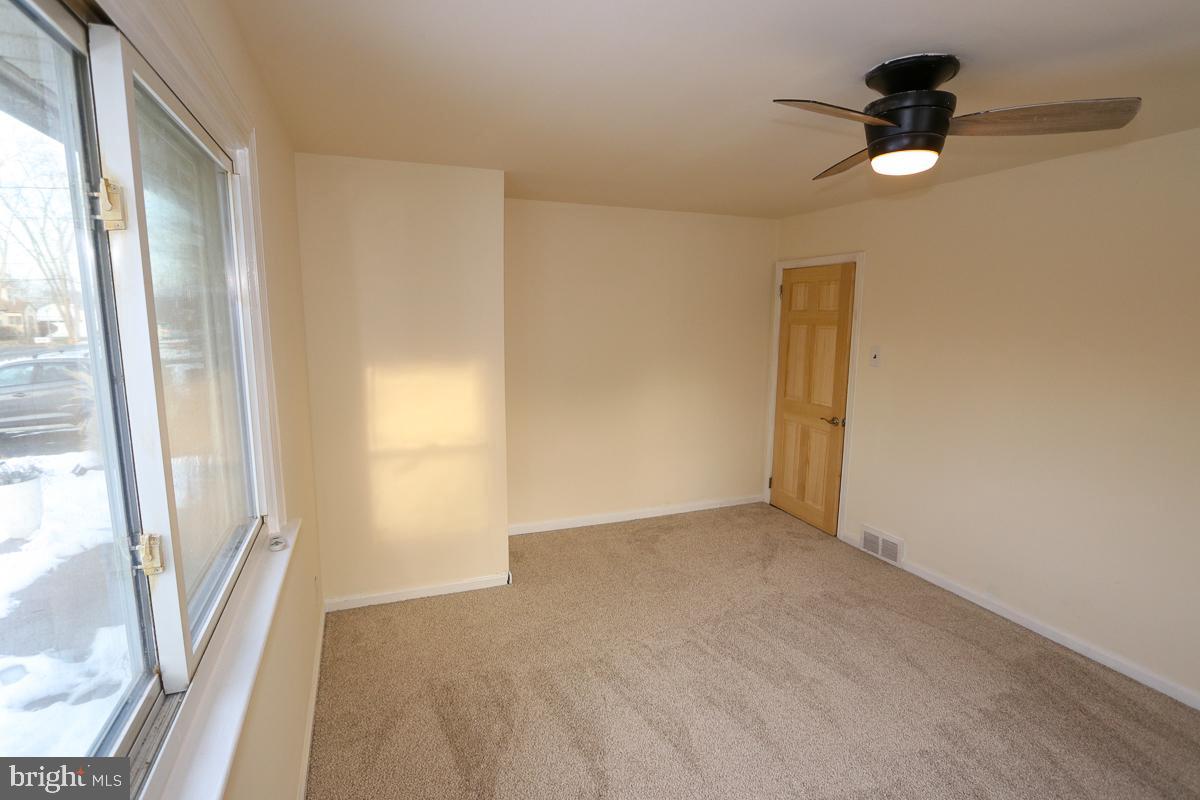 201 Castello Avenue Hatboro, PA 19040 - Photo 20 of 64 wooden floor in an empty room with a window