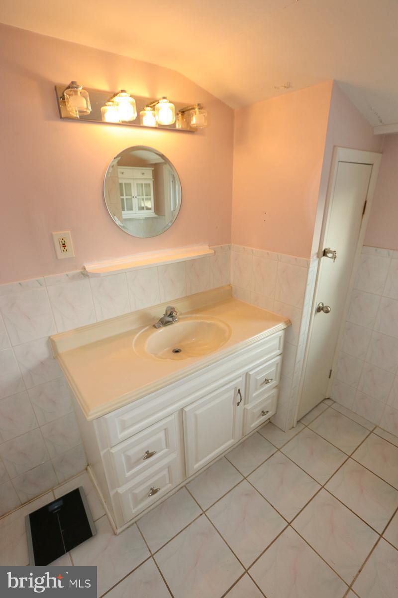 201 Castello Avenue Hatboro, PA 19040 - Photo 37 of 64 a bathroom with a sink and a mirror