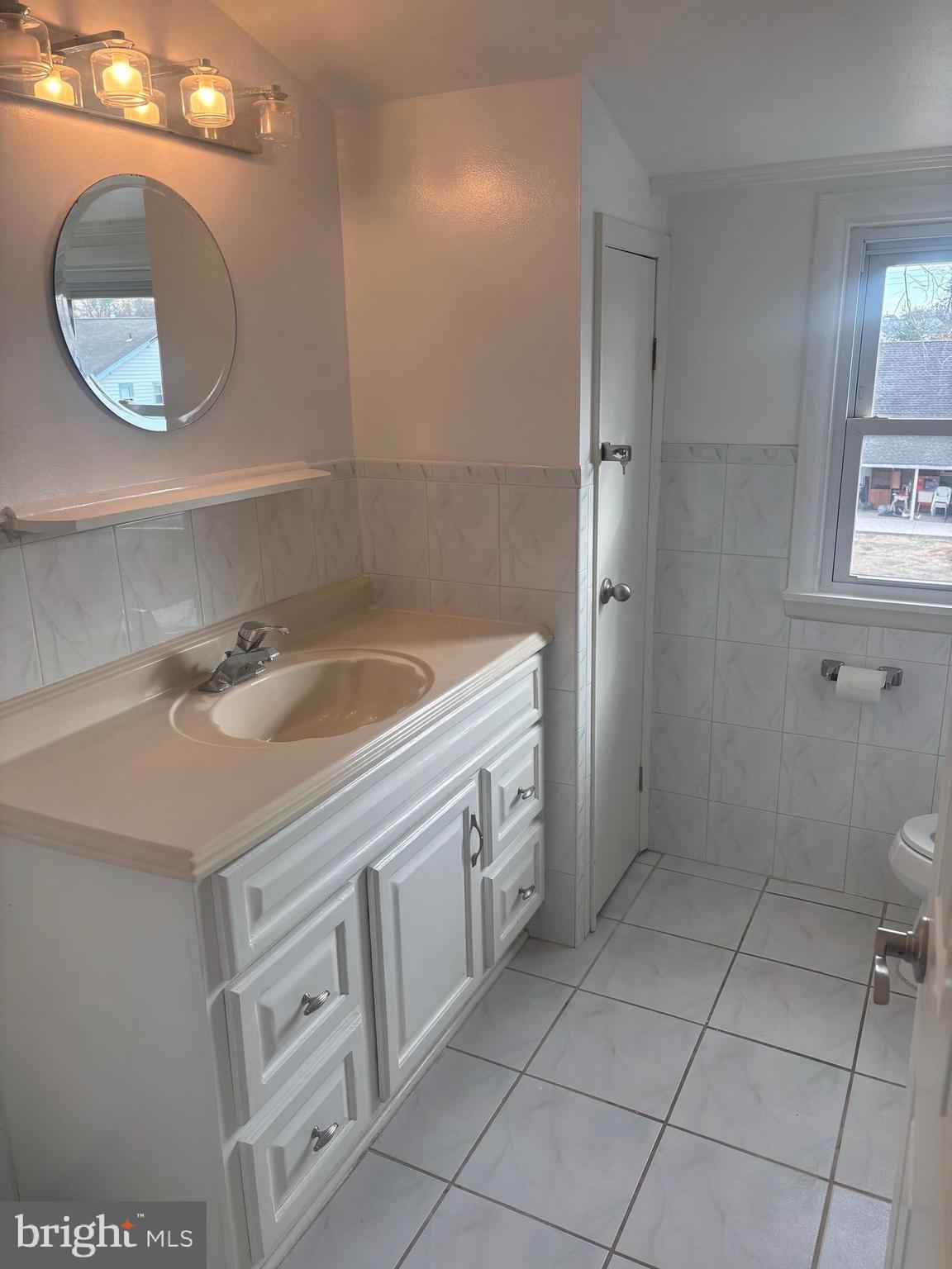 201 Castello Avenue Hatboro, PA 19040 - Photo 37 of 62 a bathroom with a sink a toilet and a mirror