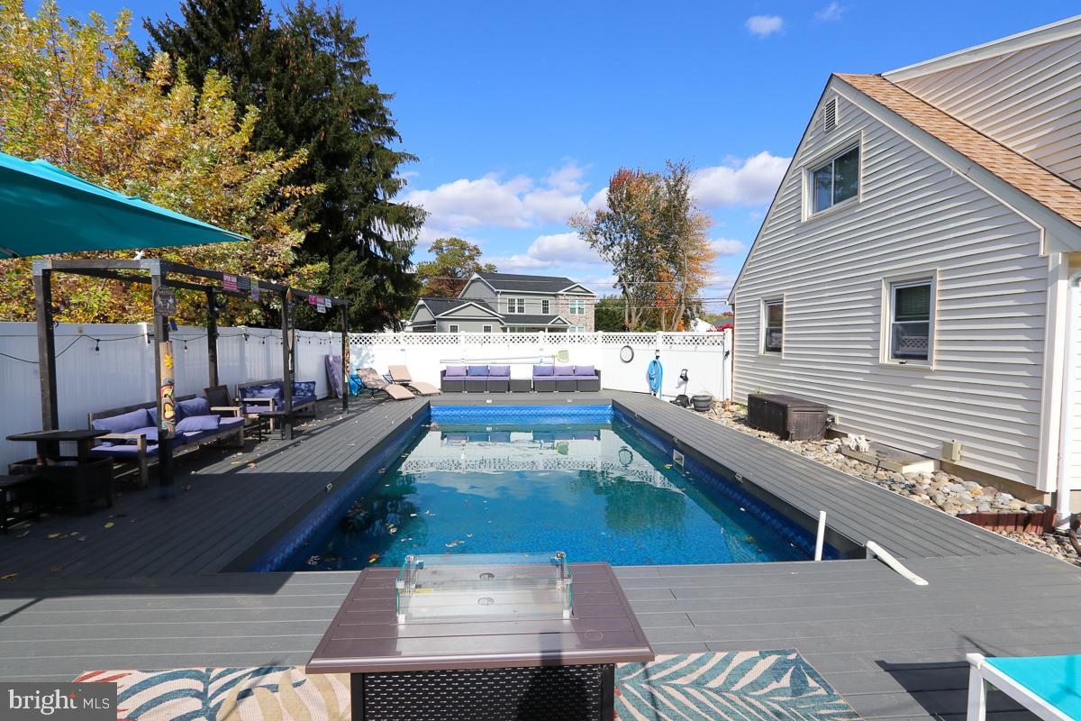 201 Castello Avenue Hatboro, PA 19040 - Photo 44 of 62 a view of a patio with swimming pool table and chairs