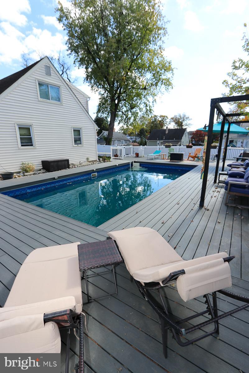 201 Castello Avenue Hatboro, PA 19040 - Photo 50 of 64 a view of deck with patio table and chairs with wooden floor and fence