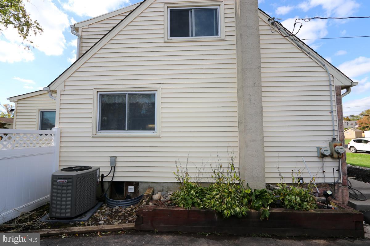 201 Castello Avenue Hatboro, PA 19040 - Photo 61 of 62 a view of a chairs and table in the back yard of the house
