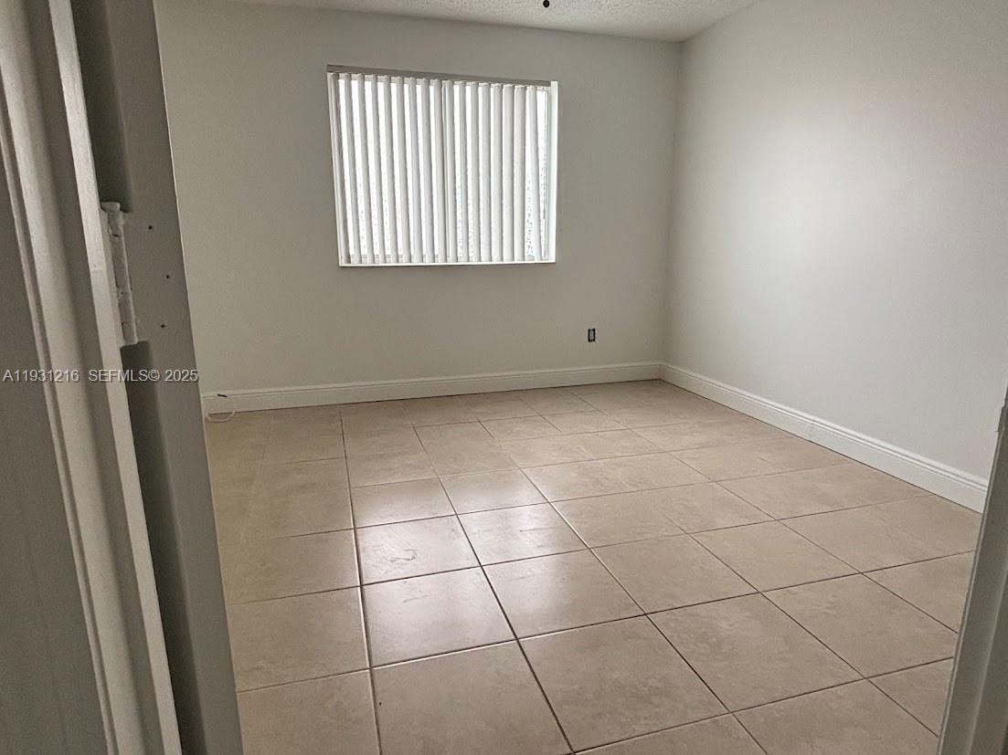 440 South Park Road, Unit 4303 Hollywood, FL 33021 - Photo 11 of 28 a view of an empty room with a window