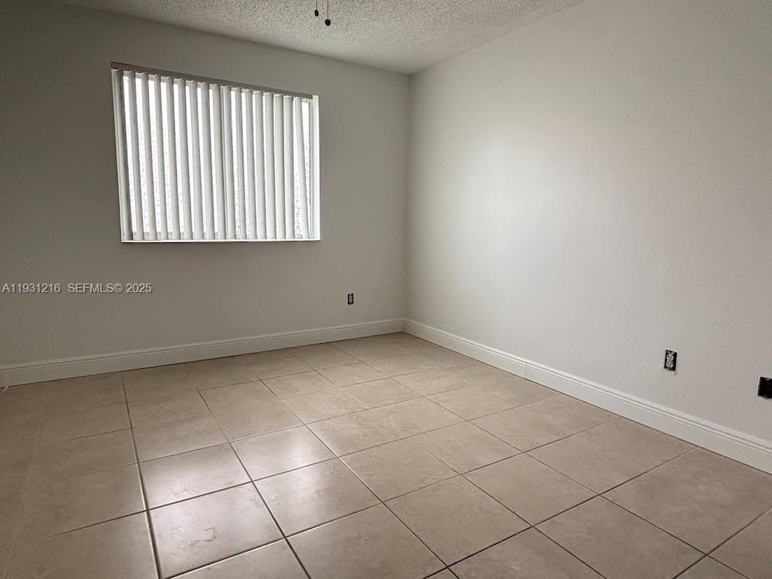 440 South Park Road, Unit 4303 Hollywood, FL 33021 - Photo 12 of 28 a view of an empty room with a window