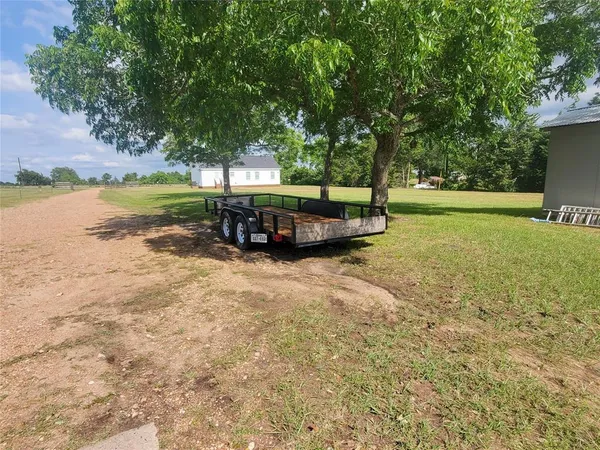 a view of a backyard with a sink and a patio