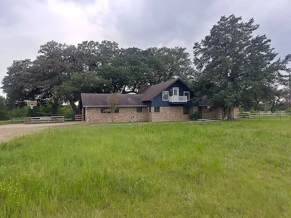 a view of a house with a big yard
