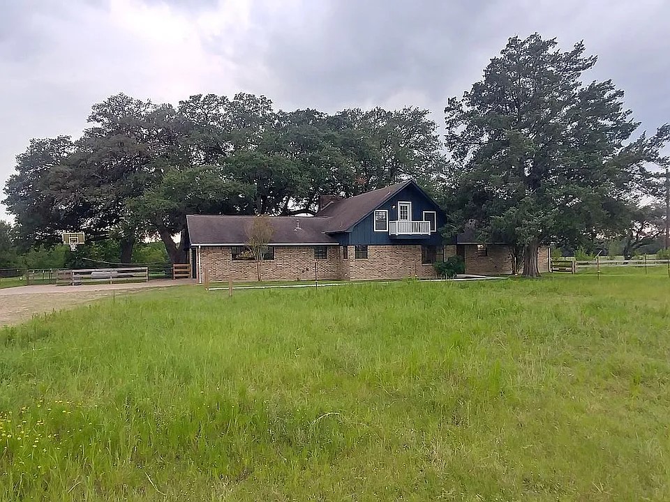 105 Red Tip Lane Brenham, TX 77833 - Photo 3 of 40 a view of a house with a big yard