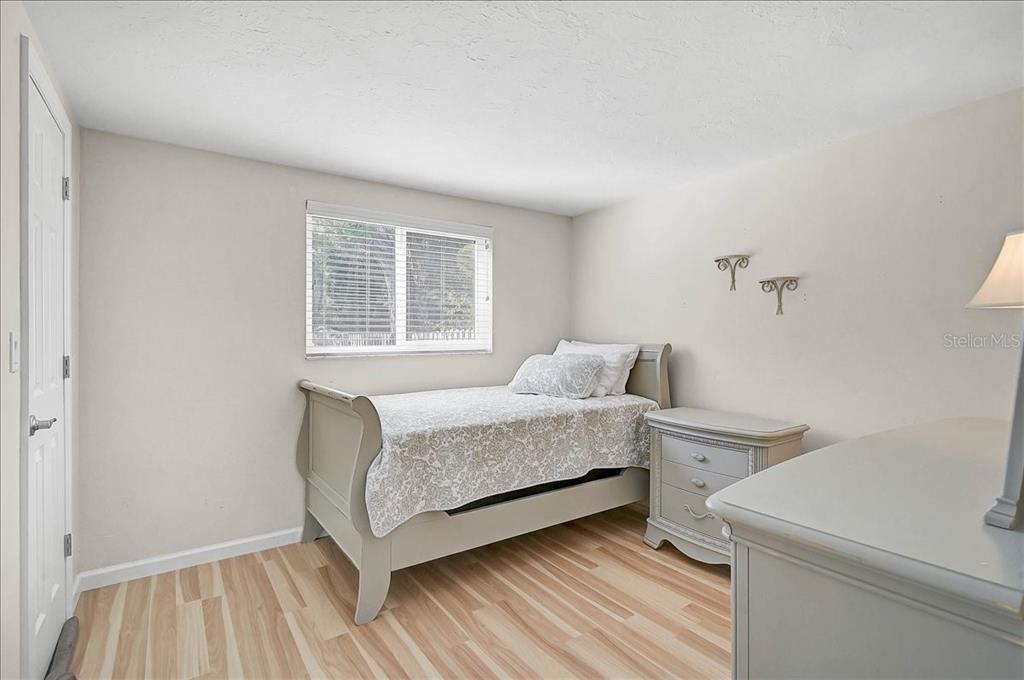 4514 South Lockwood Ridge Road Sarasota, FL 34231 - Photo 15 of 35 a bedroom with a bed and a window