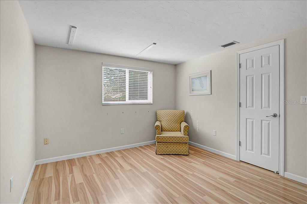 4514 South Lockwood Ridge Road Sarasota, FL 34231 - Photo 17 of 35 a view of room with stairs and wooden floor