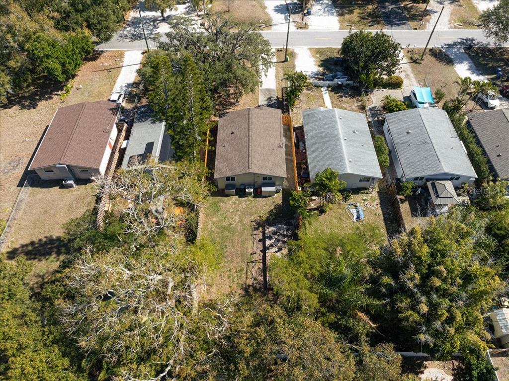 4514 South Lockwood Ridge Road Sarasota, FL 34231 - Photo 22 of 35 an aerial view of residential house with pool and trees