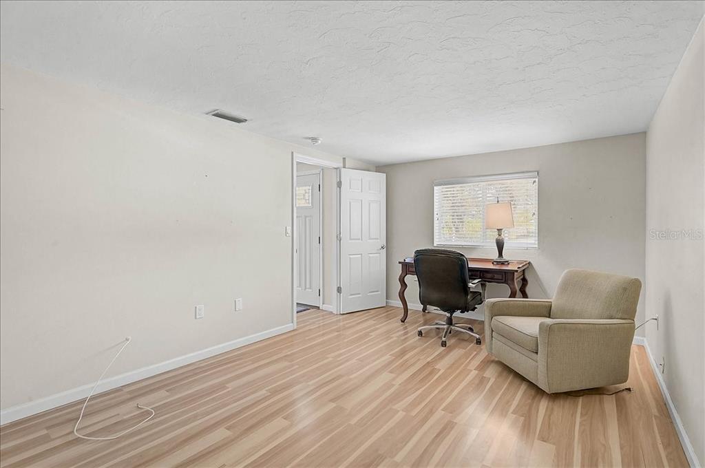 4514 South Lockwood Ridge Road Sarasota, FL 34231 - Photo 4 of 35 a living room with furniture and a window