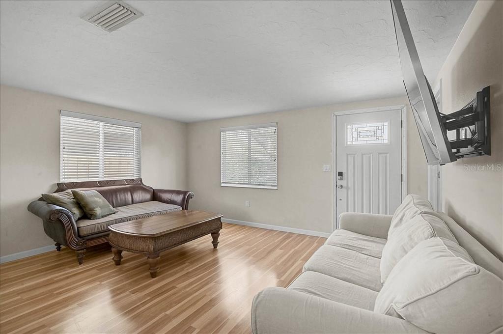 4514 South Lockwood Ridge Road Sarasota, FL 34231 - Photo 7 of 35 a living room with furniture and a window
