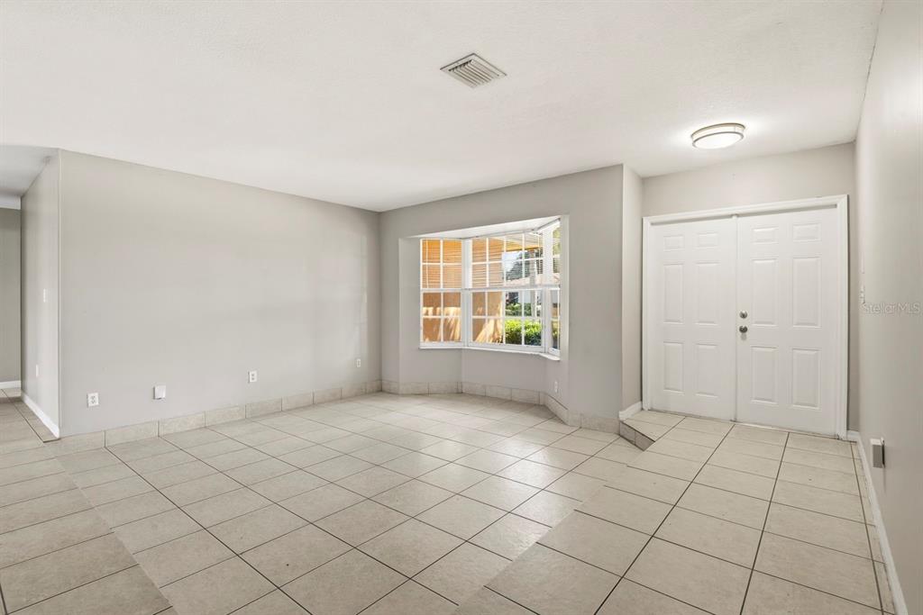 15313 Southwest 138th Terrace Miami, FL 33196 - Photo 15 of 44 an empty room with windows